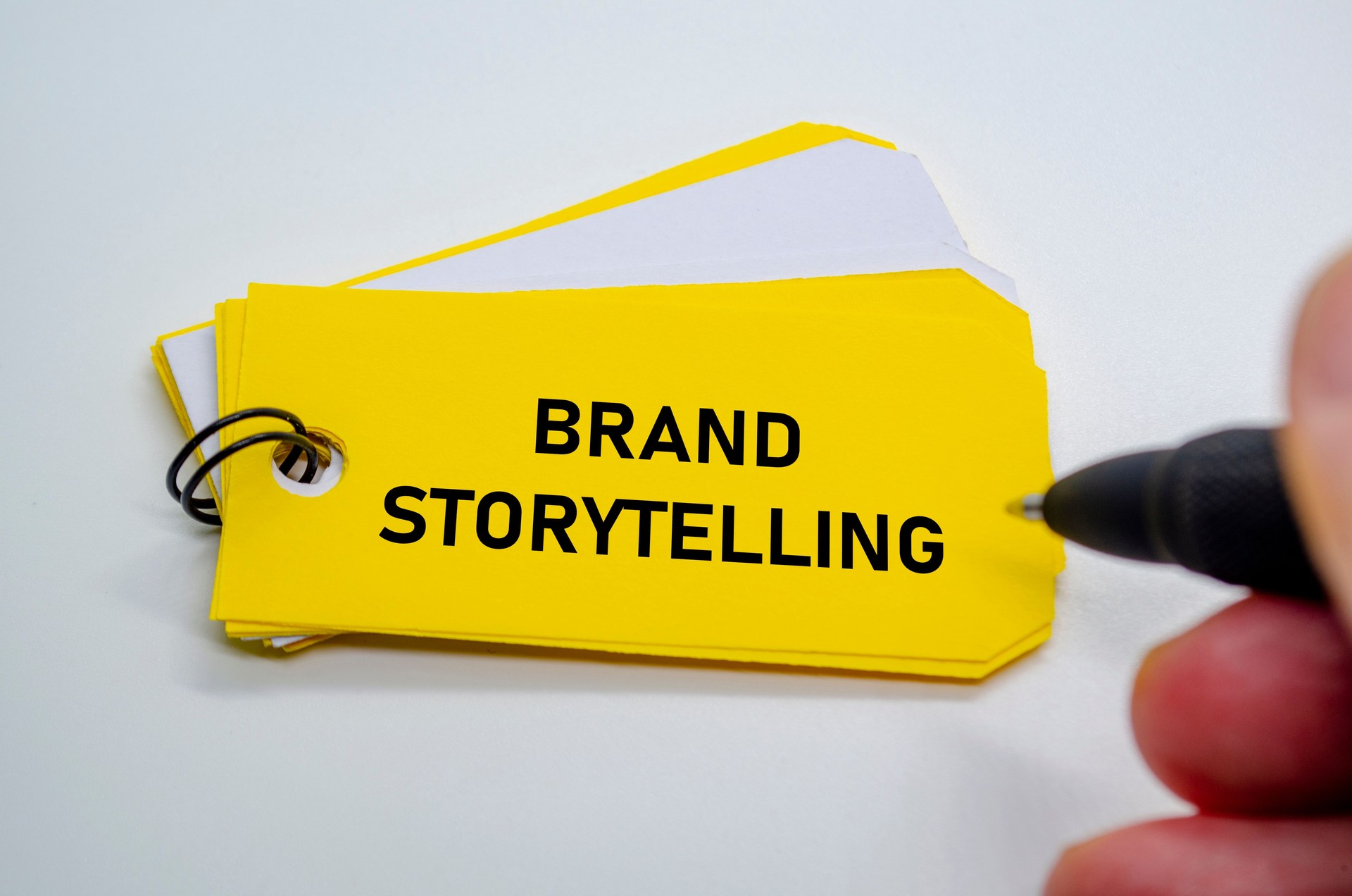 Brand storytelling theme expressed on yellow sticky note representing emotional branding connection.